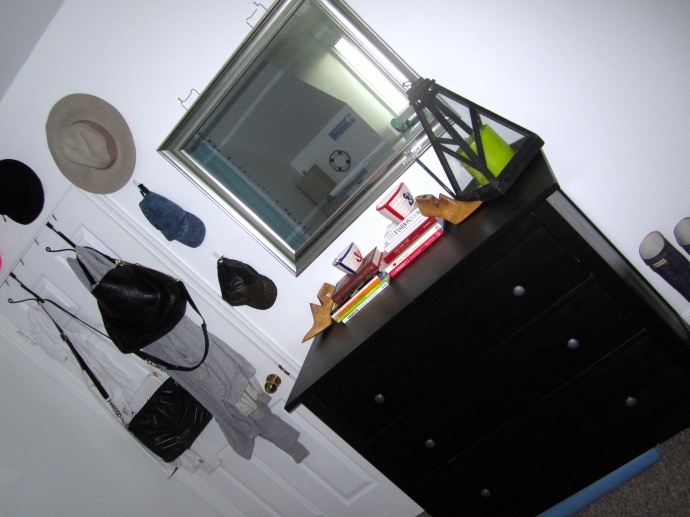 My smaller dresser and closet. I hung my hats around my closet door as wall art!